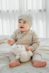 Selina Babysuit Iris lifestyle image – featuring an adorable baby wearing the iris-toned bodysuit perfect for everyday play and rest